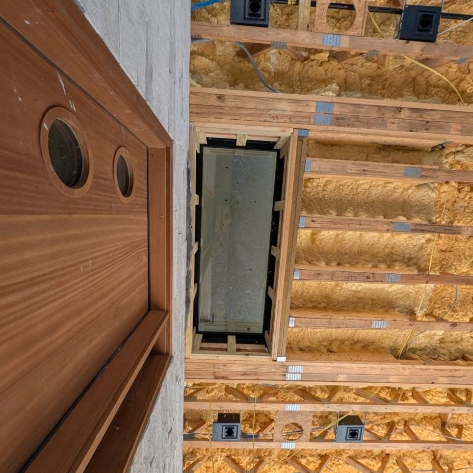 Composite of two views of wooden stairs under construction/renovation