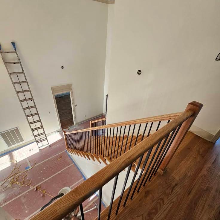 Top-down view of a wooden stair with thin balusters