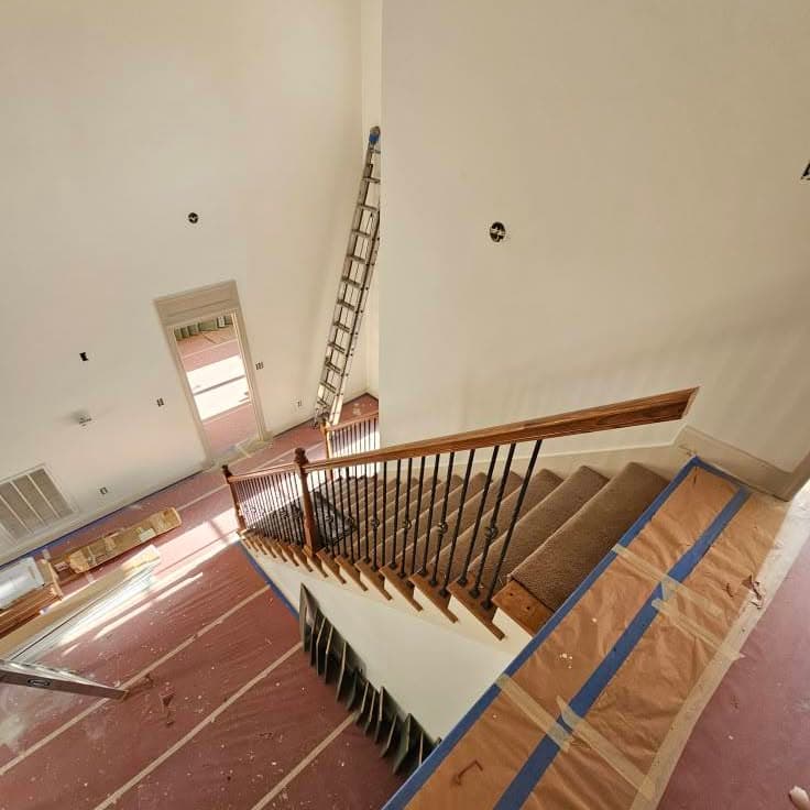 Another high-angle view down the same wooden stair