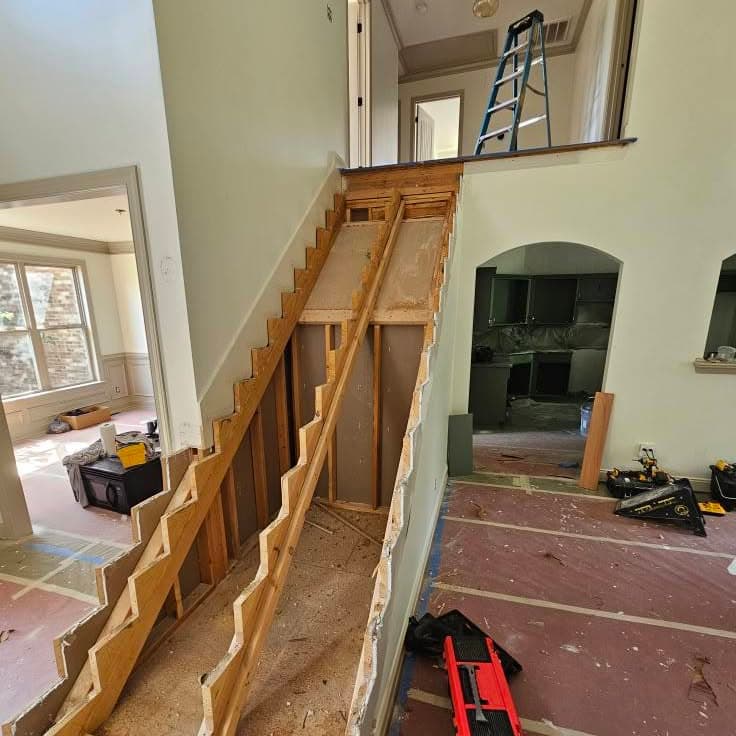 Raw wooden framing of a new staircase under construction