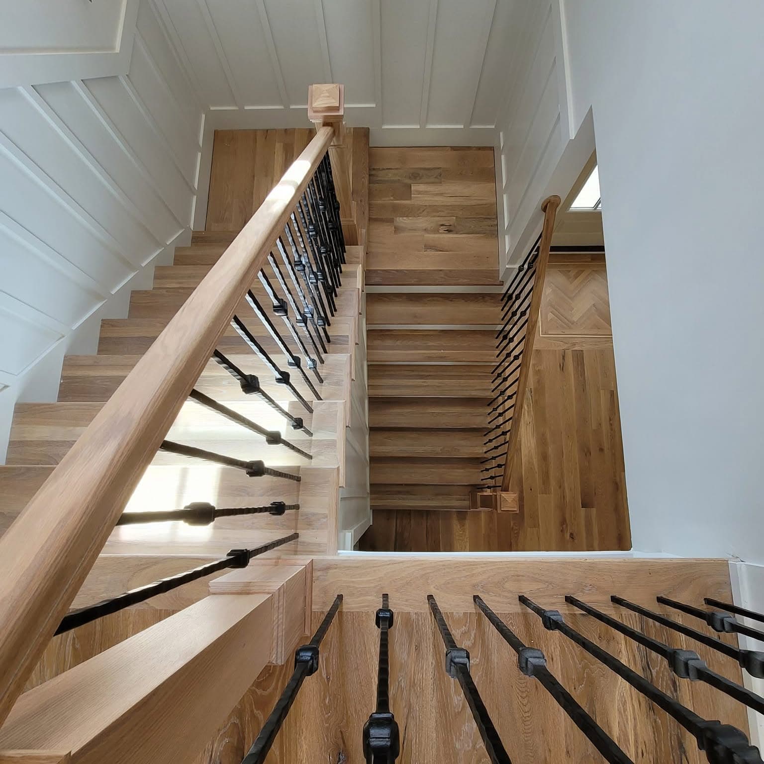 From the top looking straight down a flight of wooden stairs