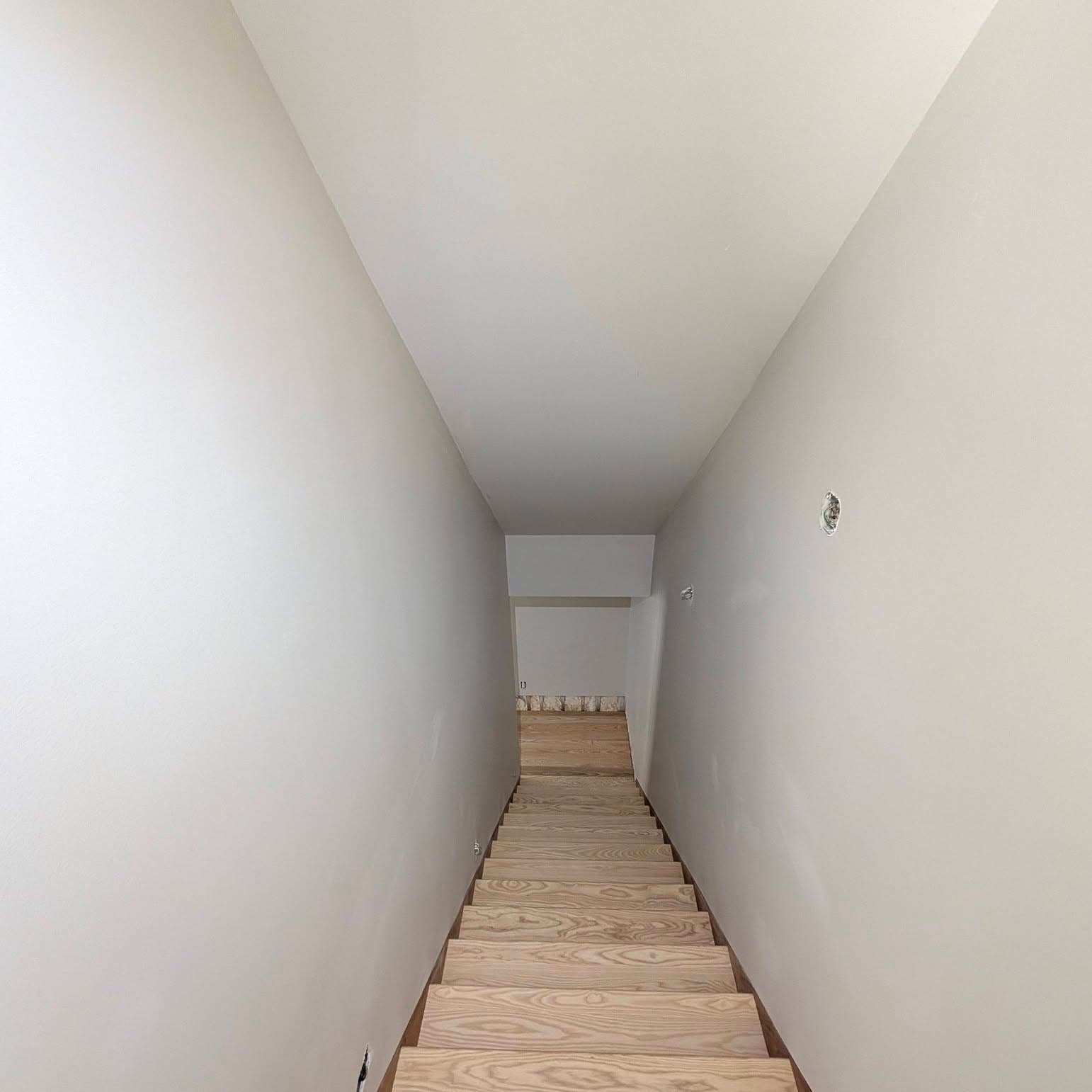 Looking down a light oak stair with white risers in a Toney, AL home, Rocket City Stairs