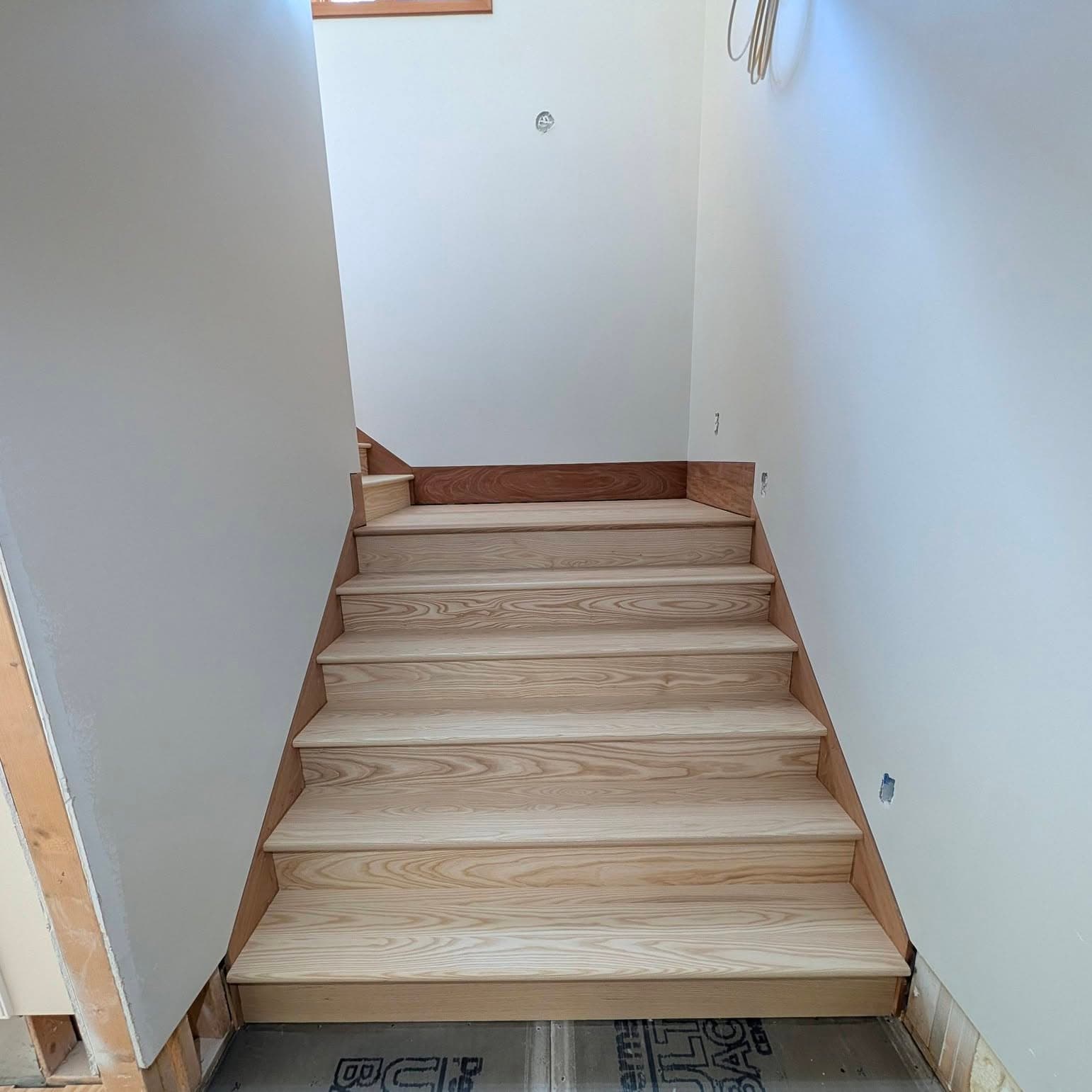 Interior stair with a wood cap and balusters in a Toney, AL home, Rocket City Stairs